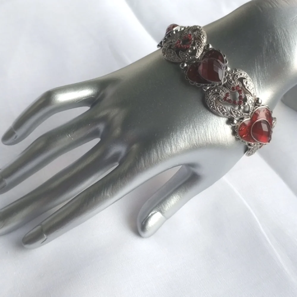 Red enamel and rhinestone encrusted silvertone heart-shaped stretchy bracelet
